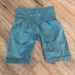 NVGTN teal shorts with contour on back side.